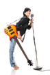 Rock-n-roll girl holding a guitar singing into retro microphone