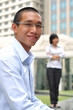 Smart Asian Man and Woman At Work