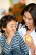 Woman and son eating fruits