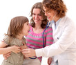 Mature doctor examining happy child