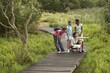 woman and children spectating plants