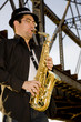 saxophonist plays outdoors saxophonist plays outdoors