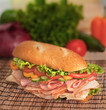Large ham & turkey sandwich ready to be eaten