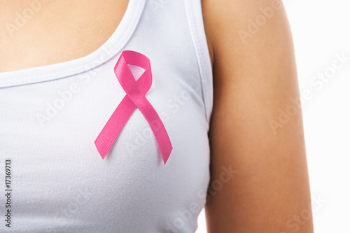 Pink badge on woman chest to support breat cancer cause