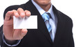 Business man handing a blank business card over white background Business man handing a blank business card over white background