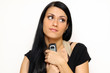 Closeup portrait of a funny woman with a phone standing indoors