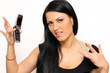 Closeup portrait of a funny woman with a phone standing indoors