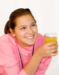 Portrait of girl. The girl drinks orange juice.