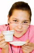 Portrait of girl. The girl drinks orange tea.