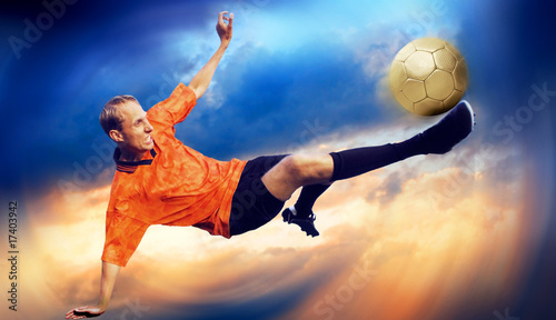 Photo: Shoot of football player on the sky with clouds Shoot of football player on the sky with clouds