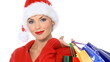 Sexy girl in santa claus hat with shopping bags