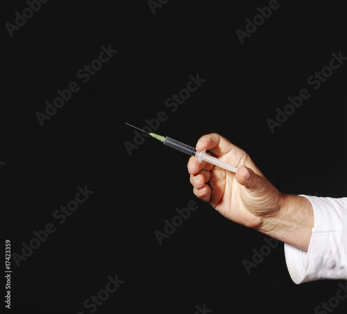 Photo: Hand with syringwe Hand with syringwe