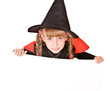 Child girl in Halloween witch costume with banner.