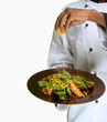 Chef sprinkling cheese on salad Chef sprinkling cheese on salad