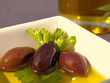 Olives up close in dish Olives up close in dish