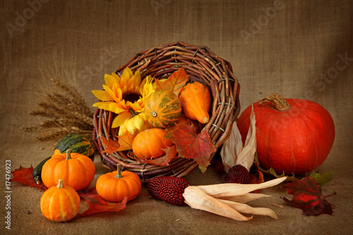 Photo: Cornucopia with pumpkins on brown background Cornucopia with pumpkins on brown background