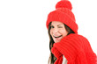 Young woman wearing red scarf and cap winking
