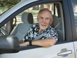 Senior man driving car