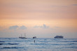 Sunset and boat - the Pacific Ocean outside Waikiki Beach
