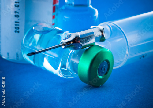 Photo: Medical syringe and phials Medical syringe and phials