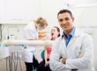 Photo: friendly dentist in office friendly dentist in office