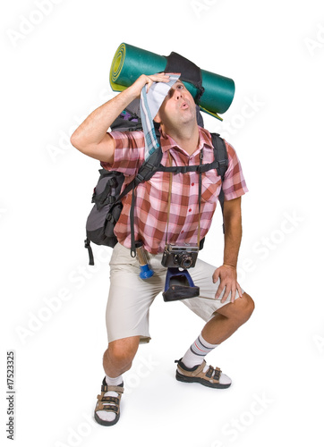 Photo: way-worn hiker with backpack way-worn hiker with backpack