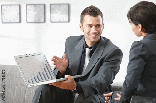 Photo: Businessman showing grapth on computer Businessman showing grapth on computer