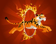 Tiger jumping through a hoop of fire.