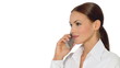 Beautiful young businesswoman is using mobile phone