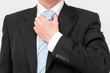 Businessman doing a blue striped tie Businessman doing a blue striped tie