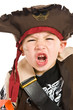 Adorable young boy in pirate costume playing trick or treat Adorable young boy in pirate costume playing trick or treat