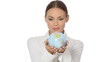Beautiful young businesswoman is holding a globe