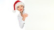 Girl in santa claus hat holding empty board