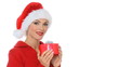 Sexy girl in santa claus hat showing a gift in box