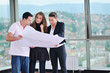 happy young couple buying new home with real estate agent