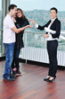 happy young couple buying new home with real estate agent