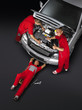 Motor mechanics are working around the car-red