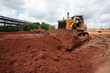 The heavy building bulldozer of yellow color The heavy building bulldozer of yellow color