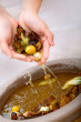 Hands with water and potpourri