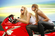 two blonde on a motorcycle