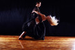 dancers in ballroom against black background dancers in ballroom against black background