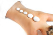 woman getting a stone massage at a spa