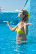 Blonde girl in swimming pool