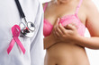 Photo: Doctor with pink badge and woman on bra Doctor with pink badge and woman on bra