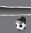 Soccer ball with hat on gray ripped advertisement