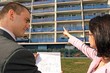 real estate agent showing flat location to potential client