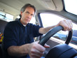 a middle aged man driving