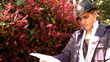 Young man reading in street