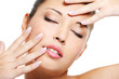 asian female with beautiful fingernails near her face asian female with beautiful fingernails near her face