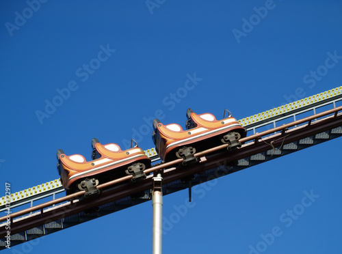 Photo: empty rollercoaster climbing up empty rollercoaster climbing up